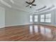 Spacious bedroom featuring beautiful hardwood floors and a tray ceiling, with many windows for natural light at 3891 Greensward Nw Vw, Kennesaw, GA 30144