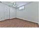 Bedroom with window, closet, and ceiling fan at 3891 Greensward Nw Vw, Kennesaw, GA 30144