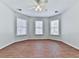 Spacious bedroom with hardwood floors and ceiling fan at 3891 Greensward Nw Vw, Kennesaw, GA 30144