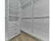 Spacious walk-in closet with custom shelving and ample storage space at 3891 Greensward Nw Vw, Kennesaw, GA 30144