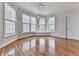 A light and airy dining area with hardwood floors, large windows, and plenty of natural light at 3891 Greensward Nw Vw, Kennesaw, GA 30144