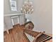 View of the entryway with a chandelier and staircase with hardwood floors at 3891 Greensward Nw Vw, Kennesaw, GA 30144