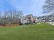 Charming brick home with lush lawn, mature trees, manicured landscaping, and a private deck at 3891 Greensward Nw Vw, Kennesaw, GA 30144