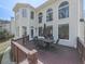 Exterior view of home with an outdoor dining area at 3891 Greensward Nw Vw, Kennesaw, GA 30144