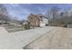 Well-maintained home features a brick facade, three-car garage, beautiful landscaping, and a curved driveway at 3891 Greensward Nw Vw, Kennesaw, GA 30144