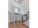 Spacious foyer with hardwood floors, high ceilings, and a staircase, leading to a bright and welcoming entryway at 3891 Greensward Nw Vw, Kennesaw, GA 30144