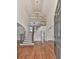 Grand foyer featuring hardwood floors, soaring ceilings, elegant chandelier, staircase, and arched doorways for a dramatic entrance at 3891 Greensward Nw Vw, Kennesaw, GA 30144