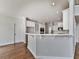 Modern kitchen features white cabinets, and plenty of countertop space, making cooking a breeze at 3891 Greensward Nw Vw, Kennesaw, GA 30144