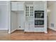 Stylish kitchen with stainless steel appliances, white cabinetry, and hardwood floors at 3891 Greensward Nw Vw, Kennesaw, GA 30144