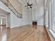 The open living room features a fireplace, large windows, and hardwood floors at 3891 Greensward Nw Vw, Kennesaw, GA 30144