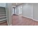 Entryway with carpeted stairs and luxury vinyl plank flooring at 3891 Greensward Nw Vw, Kennesaw, GA 30144