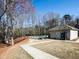 Community pool area featuring pool house with snack machines, a fenced in pool, and wooded area at 3891 Greensward Nw Vw, Kennesaw, GA 30144