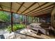Back deck area with a hot tub, latticework and a yard with lush trees at 4370 Landover Way, Suwanee, GA 30024