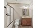 Bathroom with a vanity, tiled floors, and shower with glass doors at 4370 Landover Way, Suwanee, GA 30024