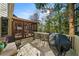 Spacious outdoor deck perfect for entertaining guests with a view of the screened porch and backyard at 4370 Landover Way, Suwanee, GA 30024