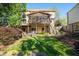 Back exterior featuring a multi-tiered deck, screened-in porch, and landscaped yard at 4370 Landover Way, Suwanee, GA 30024
