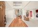 Spacious foyer with hardwood floors, a view of the living area and a staircase leading to the second floor at 4370 Landover Way, Suwanee, GA 30024