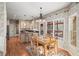 Open kitchen with center island, stainless appliances, and a cozy breakfast nook at 4370 Landover Way, Suwanee, GA 30024