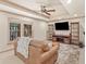 Cozy living room with ceiling fan, TV, couch and shelving at 4370 Landover Way, Suwanee, GA 30024