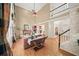 Open living room with fireplace, hardwood floors, and open staircase at 4370 Landover Way, Suwanee, GA 30024