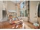 Open-concept living room featuring hardwood floors, high ceilings and staircase at 4370 Landover Way, Suwanee, GA 30024