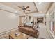 Inviting living room featuring a comfortable sofa, area rug and decorative pillows at 4370 Landover Way, Suwanee, GA 30024