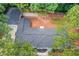 Aerial view of the home showing roof and surrounding wooded lot at 105 Simonton (Tract 1) Se Rd, Lawrenceville, GA 30046