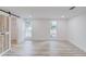 Bright bedroom featuring hardwood floors and a sliding barn door closet at 105 Simonton (Tract 1) Se Rd, Lawrenceville, GA 30046