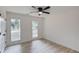 This bedroom boasts two large windows, light-colored wood floors, and a modern ceiling fan at 105 Simonton (Tract 1) Se Rd, Lawrenceville, GA 30046