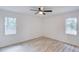 Bright bedroom with hardwood floors and two large windows at 105 Simonton (Tract 1) Se Rd, Lawrenceville, GA 30046