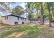 Rear exterior of the home showing the painted brick, screened porch and detached garage at 105 Simonton (Tract 1) Se Rd, Lawrenceville, GA 30046