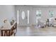 Inviting foyer with wood-look floors, a white front door, and a decorative console table at 105 Simonton (Tract 1) Se Rd, Lawrenceville, GA 30046