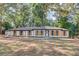 Charming single-story home with white facade, wood shutters and lush green trees at 105 Simonton (Tract 1) Se Rd, Lawrenceville, GA 30046