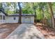 Driveway leading to a one-car garage with white exterior, perfect for parking or storage at 105 Simonton (Tract 1) Se Rd, Lawrenceville, GA 30046