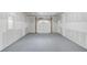 Unfinished two car garage with grey painted floor at 105 Simonton (Tract 1) Se Rd, Lawrenceville, GA 30046