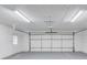 A spacious two car garage with a white garage door and door to the exterior at 105 Simonton (Tract 1) Se Rd, Lawrenceville, GA 30046