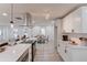 Modern kitchen with center island seating, stainless appliances, and open views to the dining and living areas at 105 Simonton (Tract 1) Se Rd, Lawrenceville, GA 30046