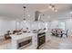 Open-concept kitchen with stainless steel appliances, quartz countertops, and wood-look flooring at 105 Simonton (Tract 1) Se Rd, Lawrenceville, GA 30046