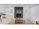 Open concept with shiplap walls, modern fireplace and a rustic coffee table over a rug at 105 Simonton (Tract 1) Se Rd, Lawrenceville, GA 30046