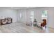 Open-concept living space with light wood-style floors and a view of the front entry at 105 Simonton (Tract 1) Se Rd, Lawrenceville, GA 30046