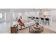 Bright, open floor plan with a white sofa, modern kitchen, and light, neutral tones throughout at 105 Simonton (Tract 1) Se Rd, Lawrenceville, GA 30046