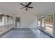 This sunroom offers natural light through a wall of windows and features a ceiling fan at 105 Simonton (Tract 1) Se Rd, Lawrenceville, GA 30046