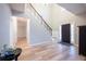 Welcoming foyer with soaring ceilings, staircase and natural light at 10715 Glenbarr Dr, Johns Creek, GA 30097