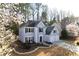 Charming two-story home featuring a two-car garage, well-manicured lawn, and classic architectural details at 10715 Glenbarr Dr, Johns Creek, GA 30097