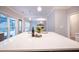 Open-concept kitchen showcasing quartz countertops, stainless steel appliances, and natural light, seamlessly connecting to adjacent living area at 10715 Glenbarr Dr, Johns Creek, GA 30097