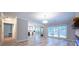 Open-concept living space showcasing views to the kitchen and backyard at 10715 Glenbarr Dr, Johns Creek, GA 30097