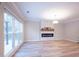 Bright living room with large windows and modern fireplace at 10715 Glenbarr Dr, Johns Creek, GA 30097