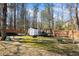 Backyard features storage shed, trampoline and open space, perfect for outdoor activities at 2130 Waters Ferry Dr, Lawrenceville, GA 30043