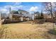 Expansive backyard featuring a multi-tiered deck, fire pit, and well-manicured lawn at 2130 Waters Ferry Dr, Lawrenceville, GA 30043