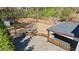 A large backyard including an outdoor deck, basketball court, and storage shed, surrounded by a wood fence at 2130 Waters Ferry Dr, Lawrenceville, GA 30043
